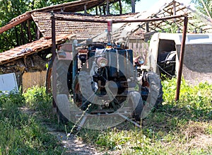 Old and dismantled open cabin tractor