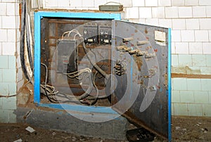 Old dismantled and rusty electrical panel assembly
