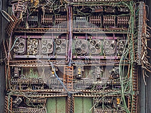 Old dismantled and rusty electrical panel assembly