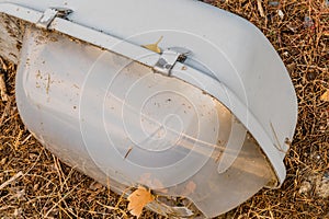 Old dismantled streetlight on ground