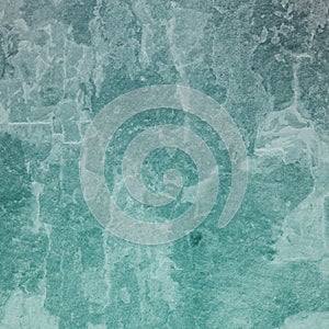 Old distressed grunge background texture in white grungy and crackled paint, weathered vintage backdrop in blue green hue