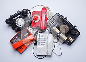 Old disused phones on white background