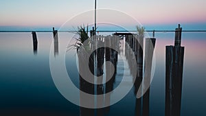 Old dock Lake Monroe at downtown Sanford Riverwalk in Florida at sunset