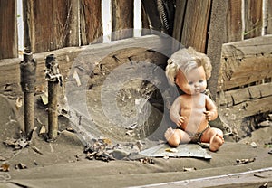 Old doll in an abandoned house
