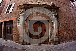 Old Door in a Brick Building