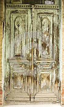 An old door in a brick house of the last century