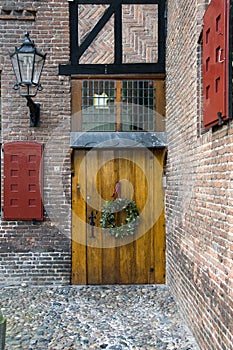 Old door with christmas guirlande