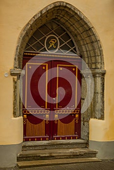 Old door with decor in the old town. Tallinn. Estonia