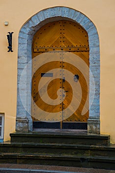 Old door with decor in the old town. Tallinn. Estonia