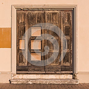 An old door on a derelict and abandoned building in Senigallia, Italy photo