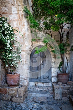 Old door in the fabulous Lindos city. Charming streets