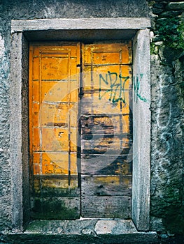 Old door with graffitis