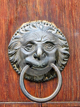 Old door handle close-up in Toscany, Italy.