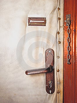 Old door handle and lock with a chain