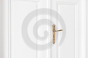 Old door handle on white door