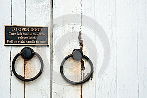 Old door handles with instructions