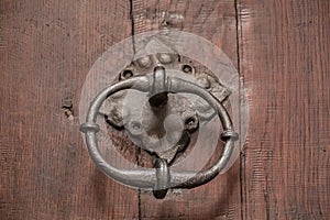 Old door of a historical building with iron door knob