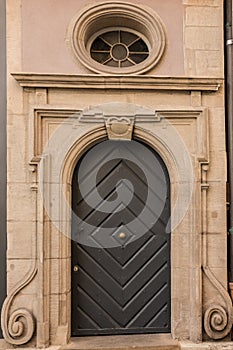 Old door of a historical building with stairway