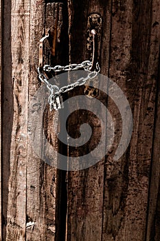 Old door with lock and chain