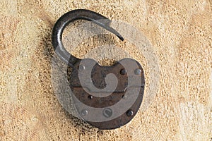 old door lock on a wooden background