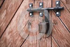 The old door locked with a padlock hanging brackets. Set of backgrounds