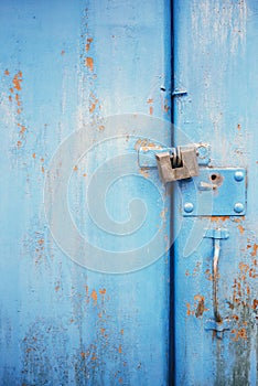 The old door locked with a padlock hanging brackets. Set of backgrounds