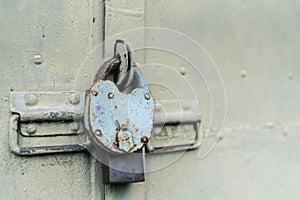 The old door locked with a padlock hanging brackets. Set of backgrounds