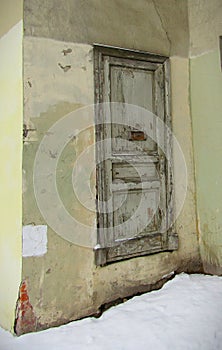 Old door with mailbox in winter