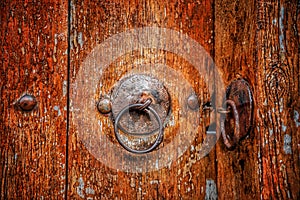 Old door with the metal round doorknobs, background photo
