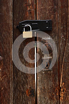 Old door with new padlock photo