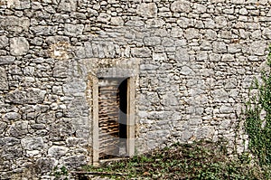 Old door on an old stone house in Dobrinj, island Krk, Croatia.