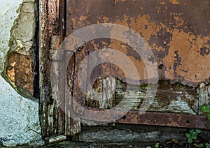 Old door and rusty hinges