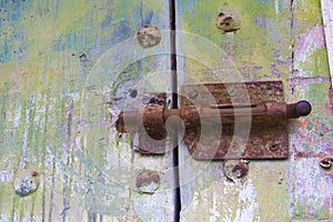 Old door with rusty latch.