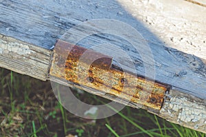 Old door with rusty loop, close - up