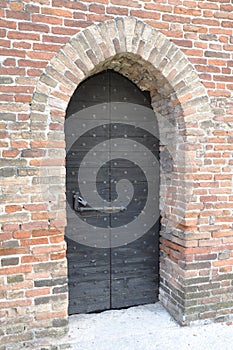 Old door in stone castle, Verona