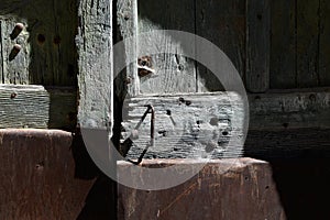 Old door weathered with missing parts