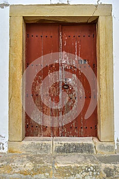 Old door in a white wall