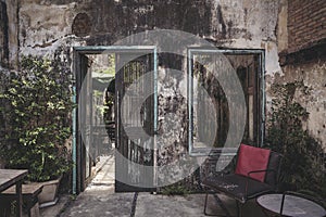 Old door and window, entrance. Thailand, Phangnga, Takua Pa The interior of the coffee shop in the old walls of the