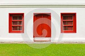 The old door and windows red on white wall