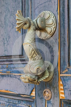 Old doorknocker in the form of a fish