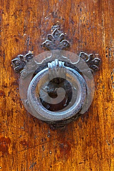 Old doorknocker at a Tuscan door