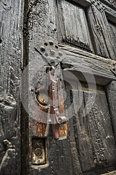 Old doors decorating the facade of a house photo