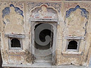 Old doors and windows in an ancient palace or haveli in Mandawa, Rajasthan, India