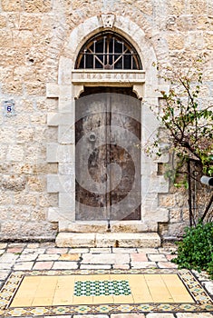 Old double door with half round transom, Jerusalem photo