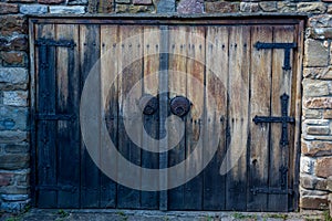 Old double wooden house door to street in Bulgaria