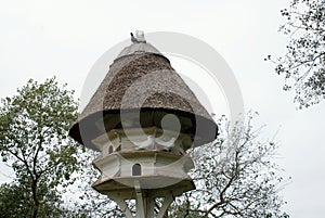 Old dovecote with thatched roof.