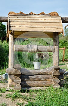 Old draw well with iron bucket