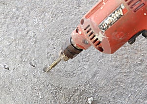Old drill with concrete