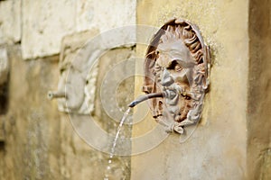 Old drinking water fountain of the famous Pitigliano town, located atop a volcanic tufa ridge. Beautiful italian towns and