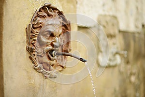 Old drinking water fountain of the famous Pitigliano town, located atop a volcanic tufa ridge. Beautiful italian towns and